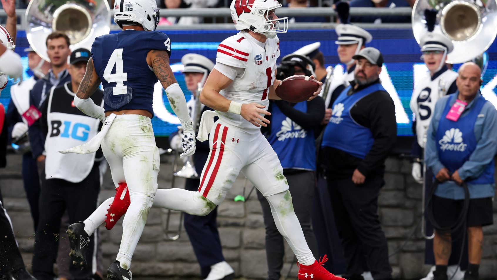Wisconsin quarterback Colton Joseph runs for a touchdown against Penn State