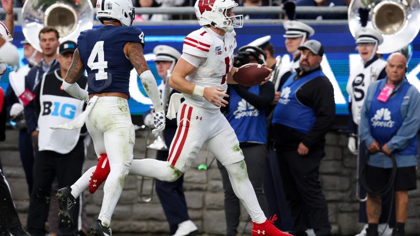 Wisconsin quarterback Colton Joseph runs for a touchdown against Penn State