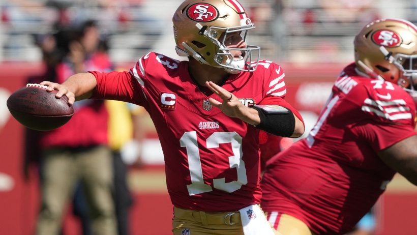 Brock Purdy fires a pass against the Cardinals.