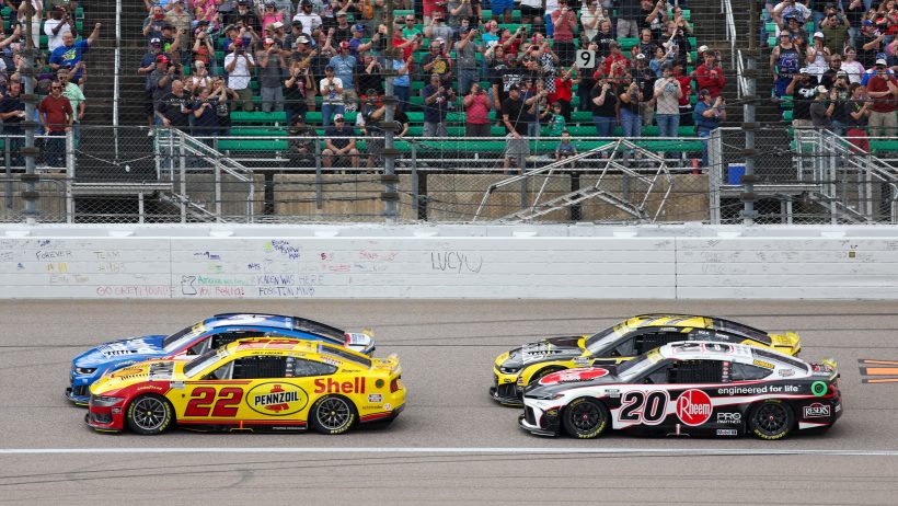 Joey Logano and Christopher Bell on-track in Kansas (2026).