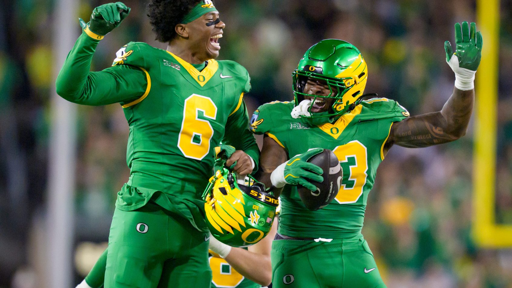 Oregon's Gavin Nix and Jerry Mixon celebrate a turnover