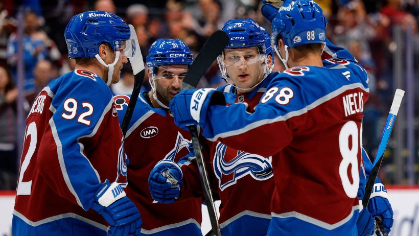 Nathan MacKinnon celebrates with teammates.