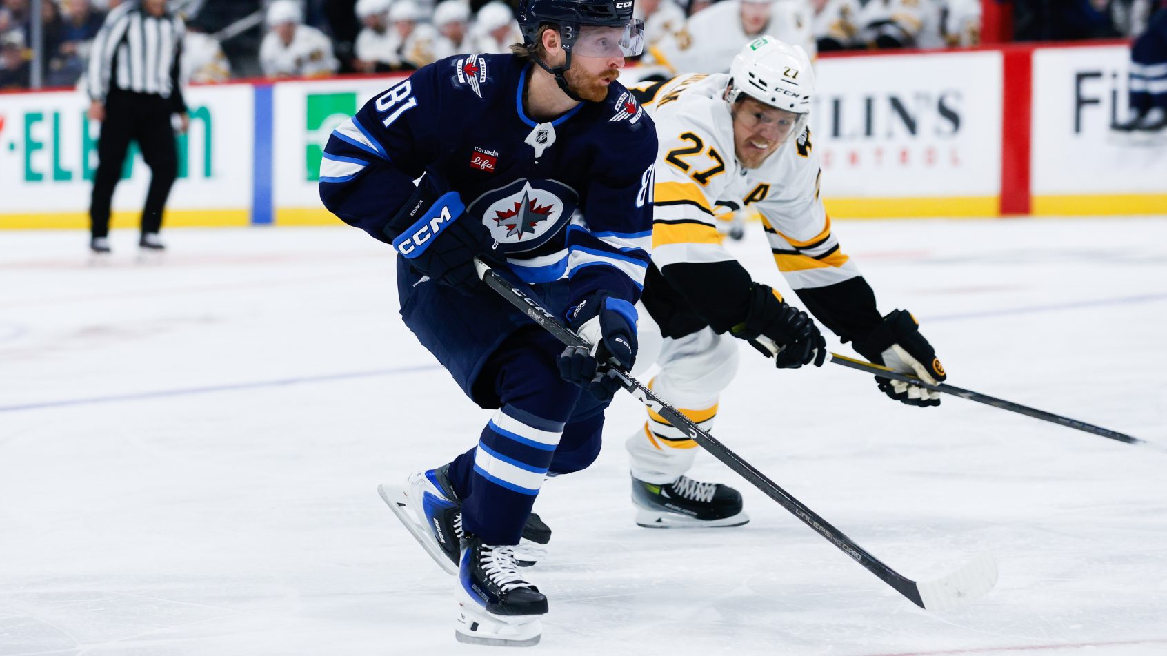 Winnipeg Jets forward Kyle Connor skates with the puck against Boston