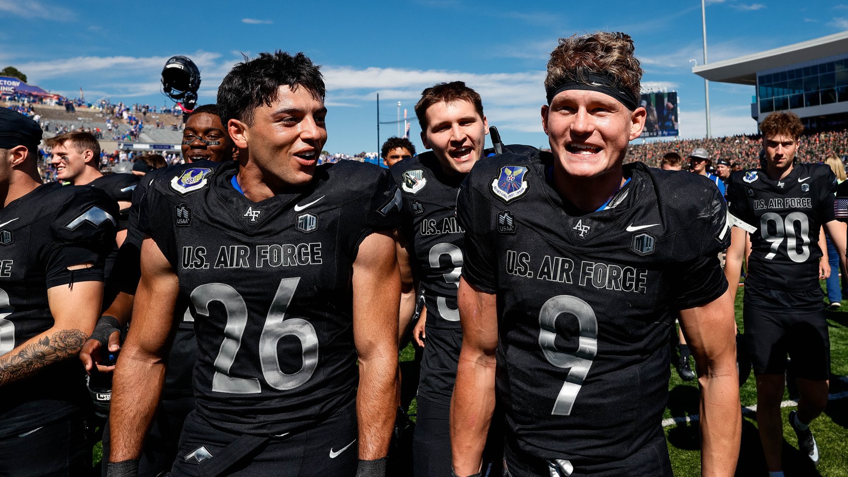 Alexander Perez and Liam Szarka celebrating with teammates