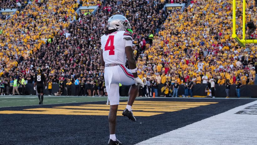 Jeremiah Smith strikes a Heisman pose after scoring against Iowa