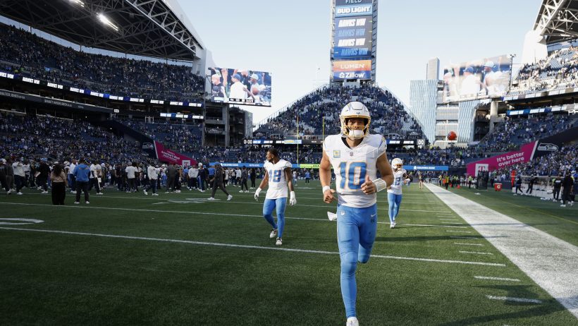 Justin Herbert running onto the field
