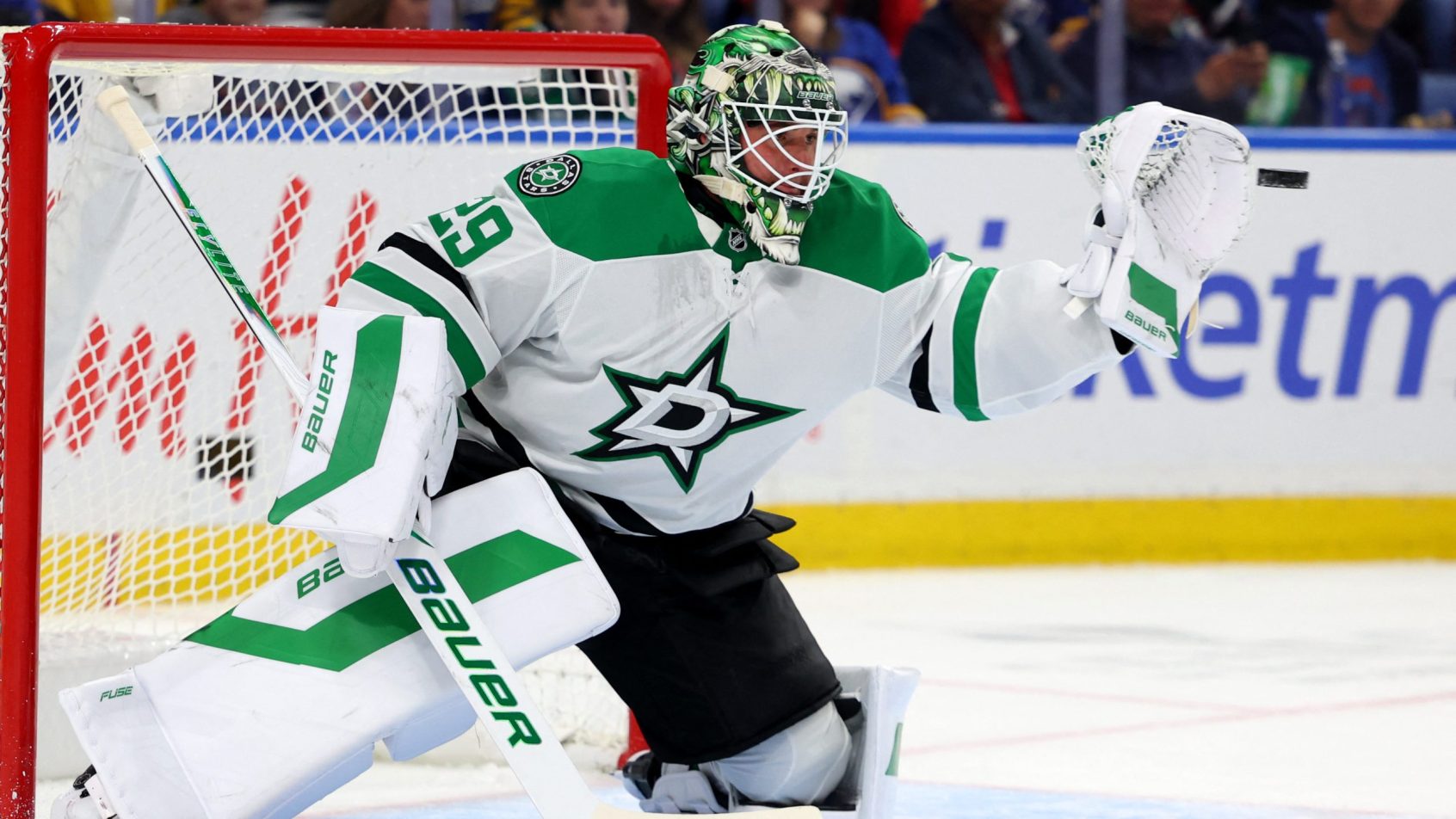 Jake Oettinger makes a glove save vs the Sabres.