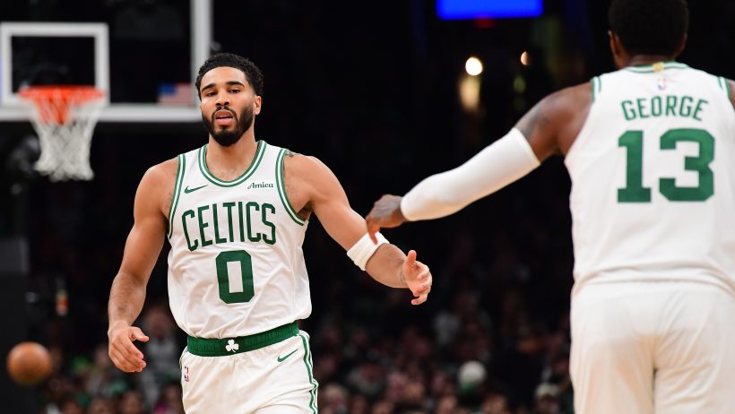 Jayson Tatum high fives with Paul George following a bucket.