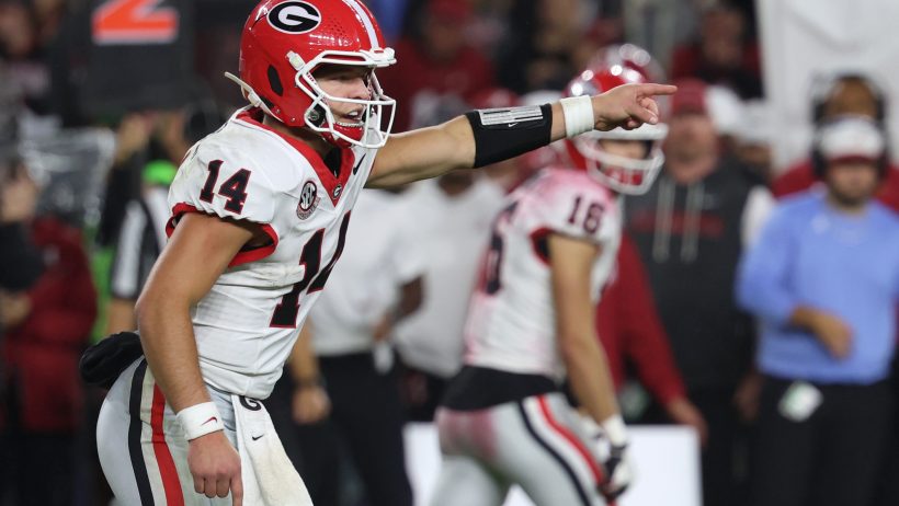 Gunner Stockton pointing at line of scrimmage