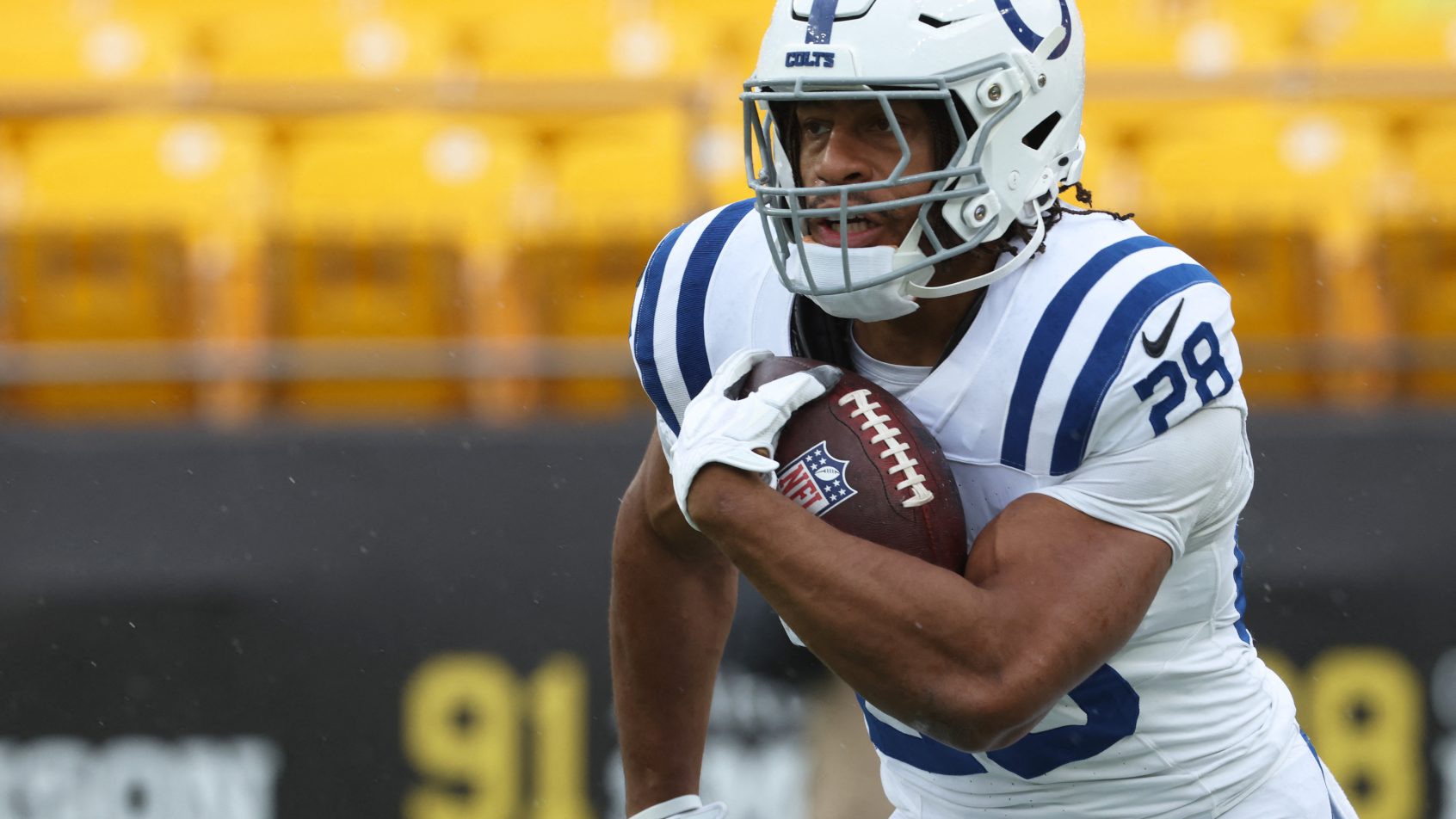 Jonathan Taylor running with ball