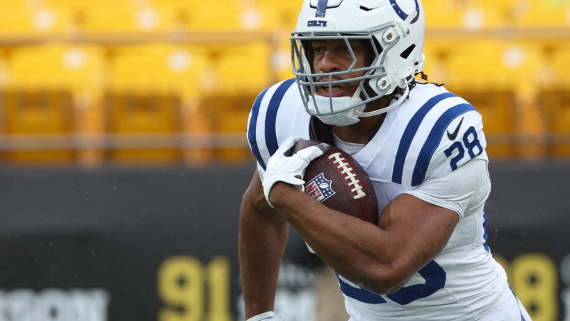 Jonathan Taylor running with ball