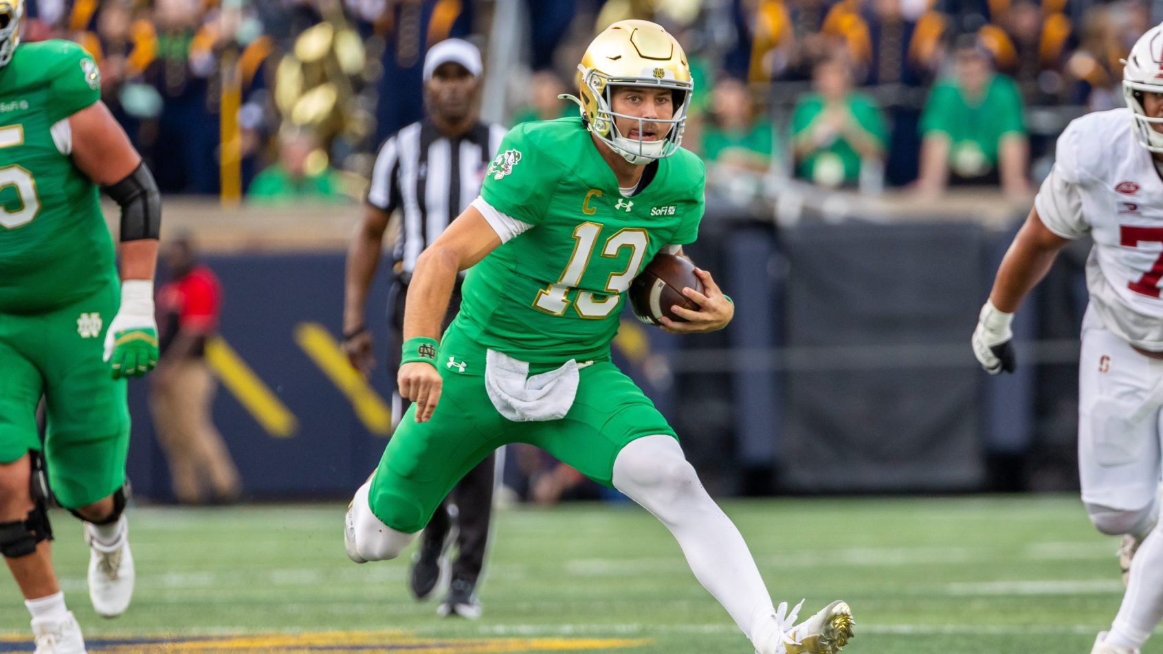 CJ Carr scrambles during a victory over Stanford.