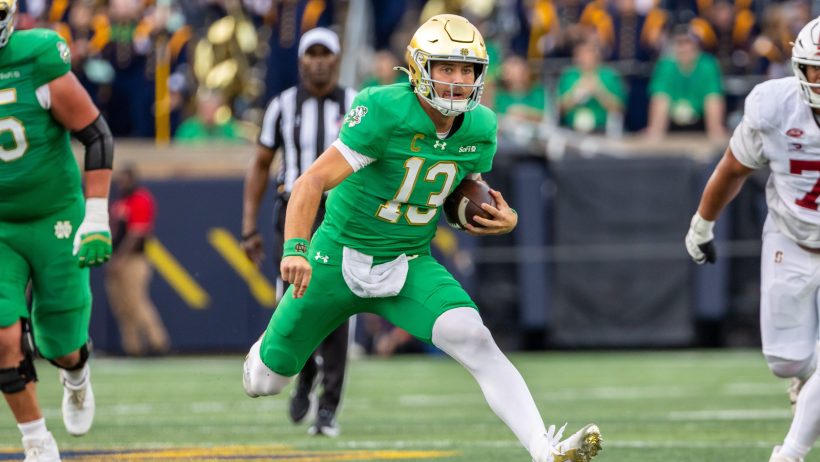 CJ Carr scrambles during a victory over Stanford.