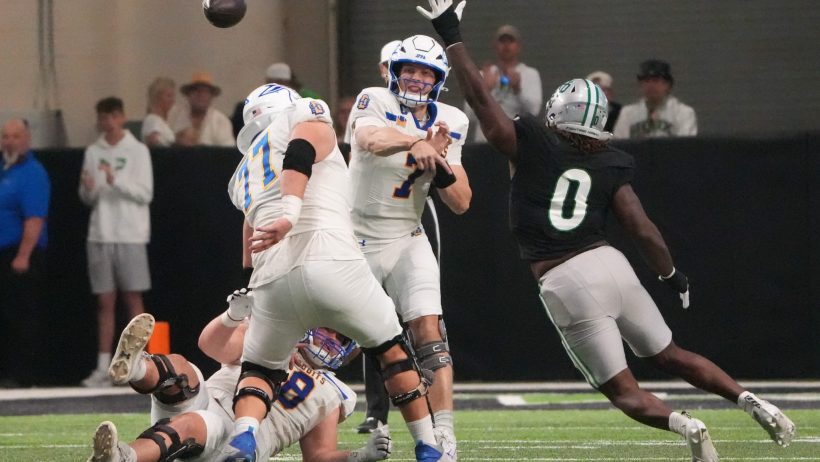 South Dakota State quarterback Chase Mason throws a pass against North Dakota