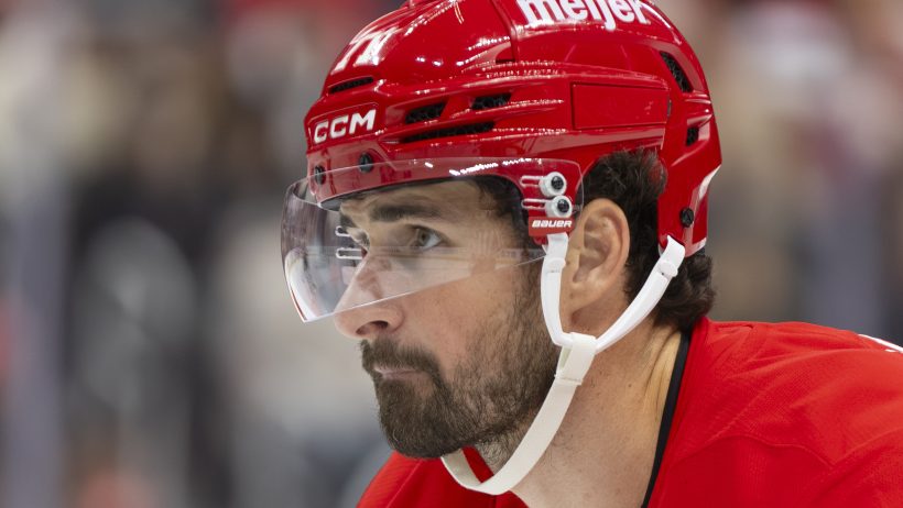 Close-up of Detroit Red Wings center Dylan Larkin looking on during a game.