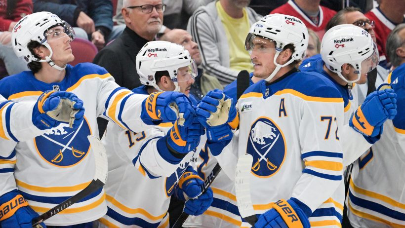 Tage Thompson celebrates with teammates.