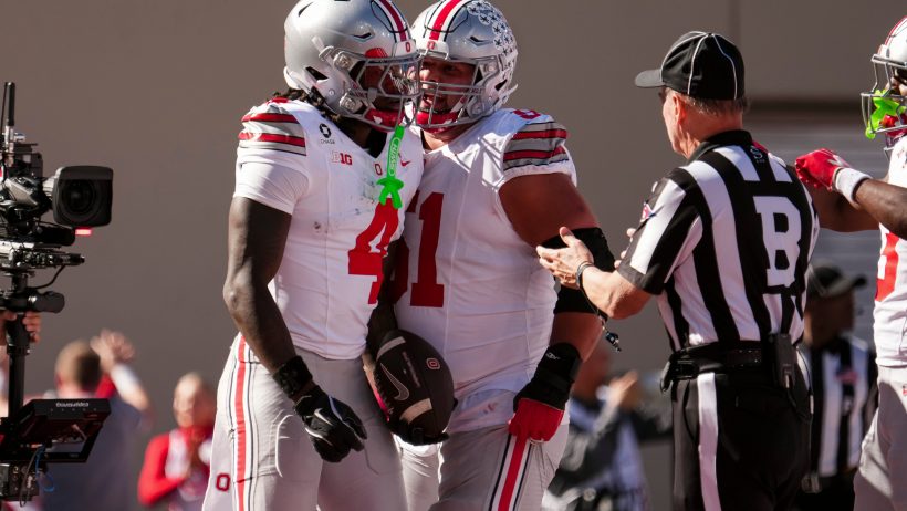 Ohio State wide receiver Jeremiah Smith celebrates a touchdown with Luke Montgomery.