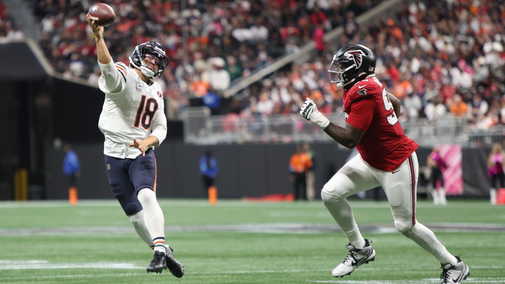 Chicago Bears quarterback Caleb Williams throwing a pass