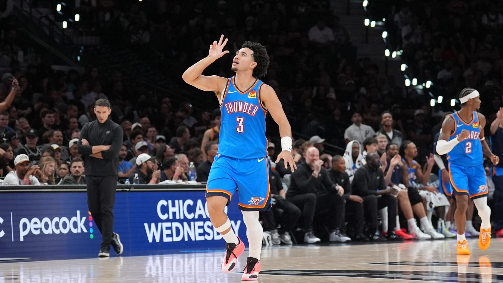 Jared McCain celebrates a triple vs the Spurs.