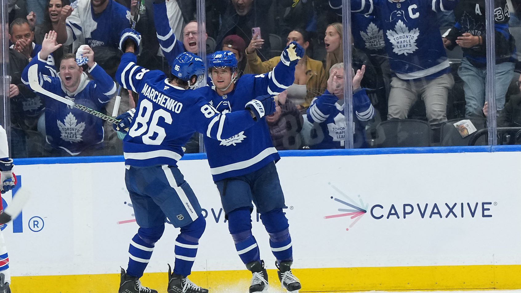 Kirill Marchenko scores a goal and celebrates with right wing William Nylander.
