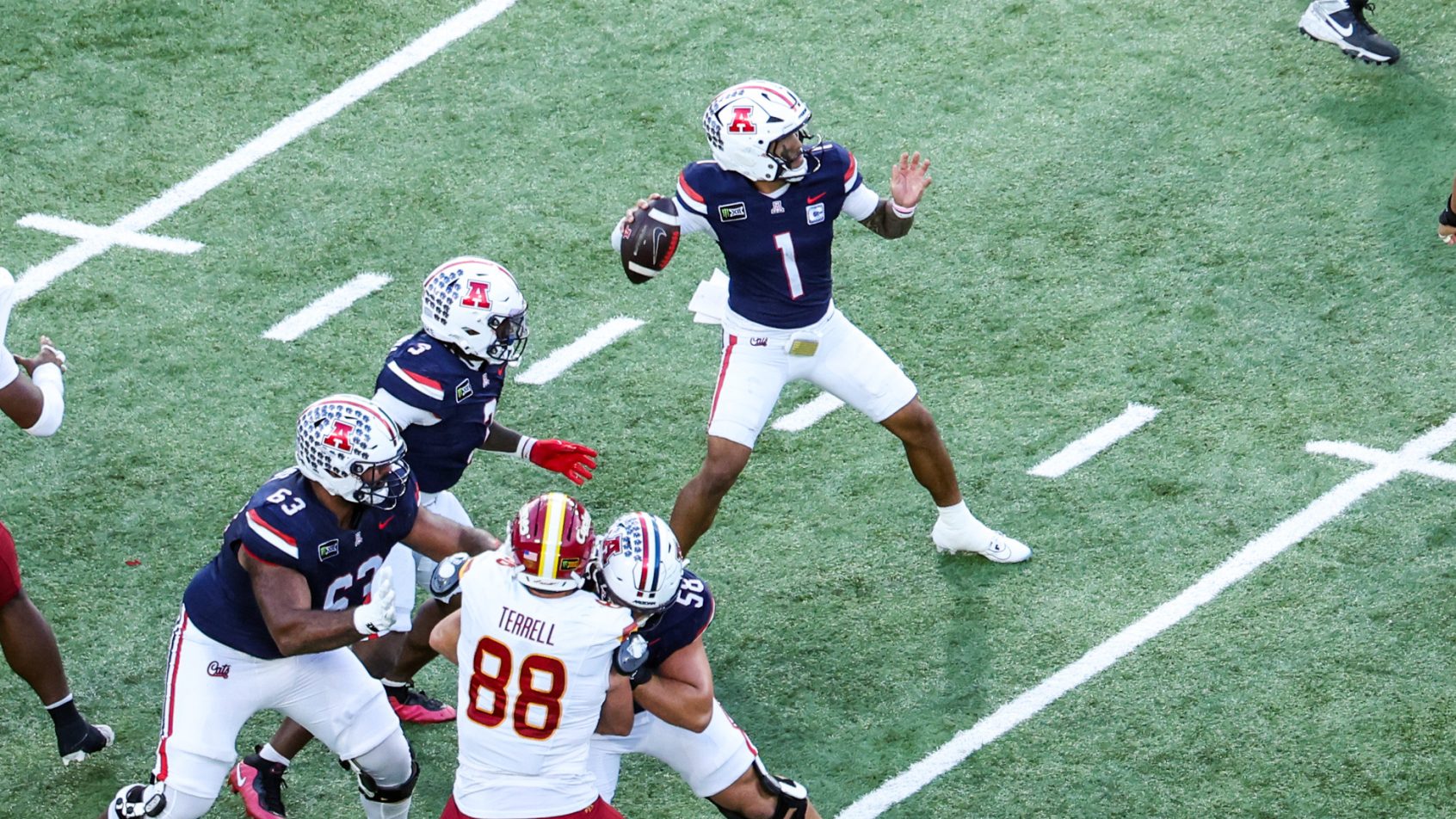 Arizona quarterback Noah Fifita looks to pass against Iowa State