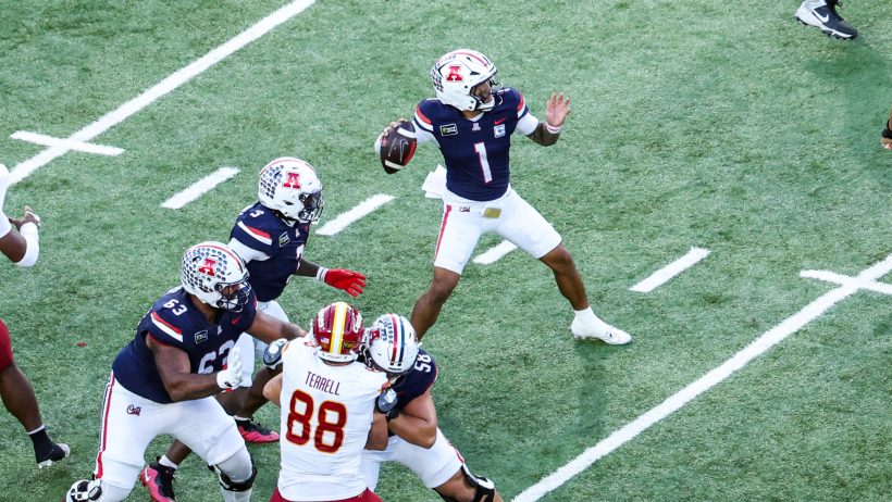 Arizona quarterback Noah Fifita looks to pass against Iowa State