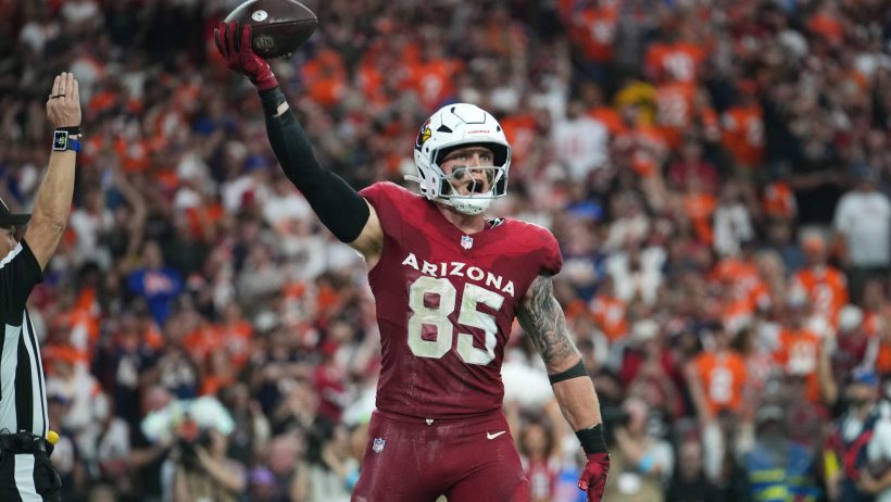 Trey McBride celebrates a TD vs the Broncos.