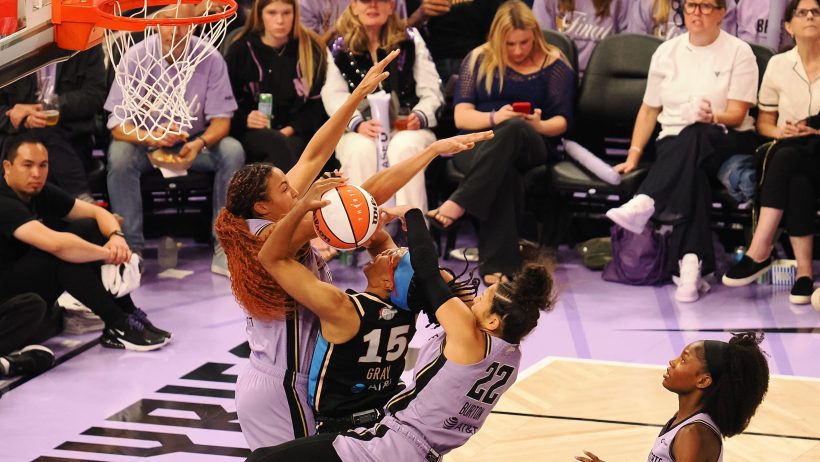 Allisha Gray is stopped at the rim by the Golden State defense.