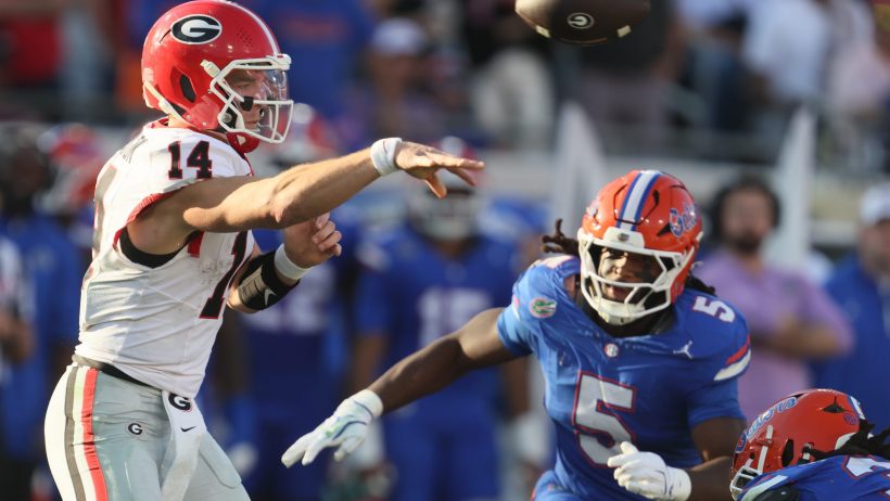 Georgia quarterback Gunner Stockton throws under pressure against Florida.