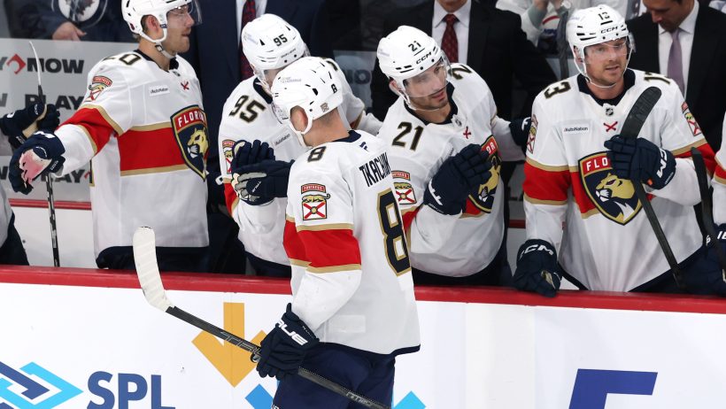 Brady Tkachuk celebrates with teammates.