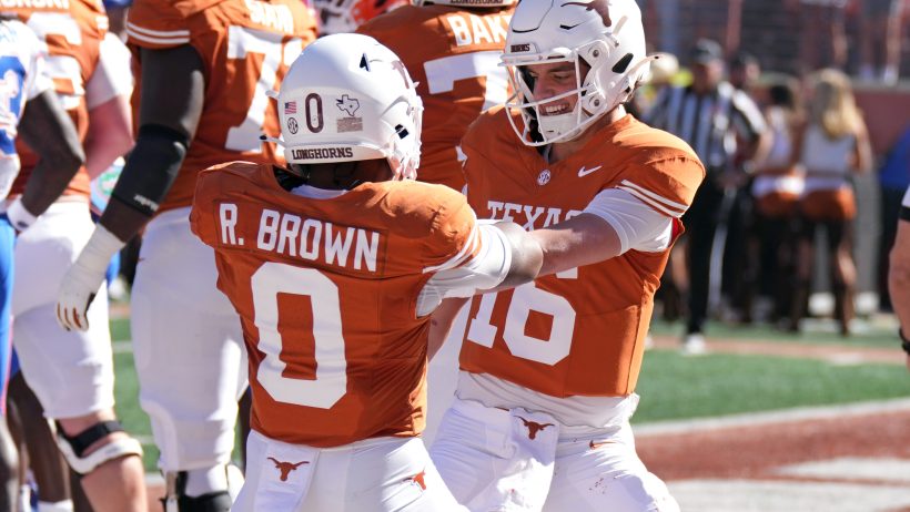 Texas quarterback Arch Manning celebrates a touchdown with Raleek Brown against Florida.