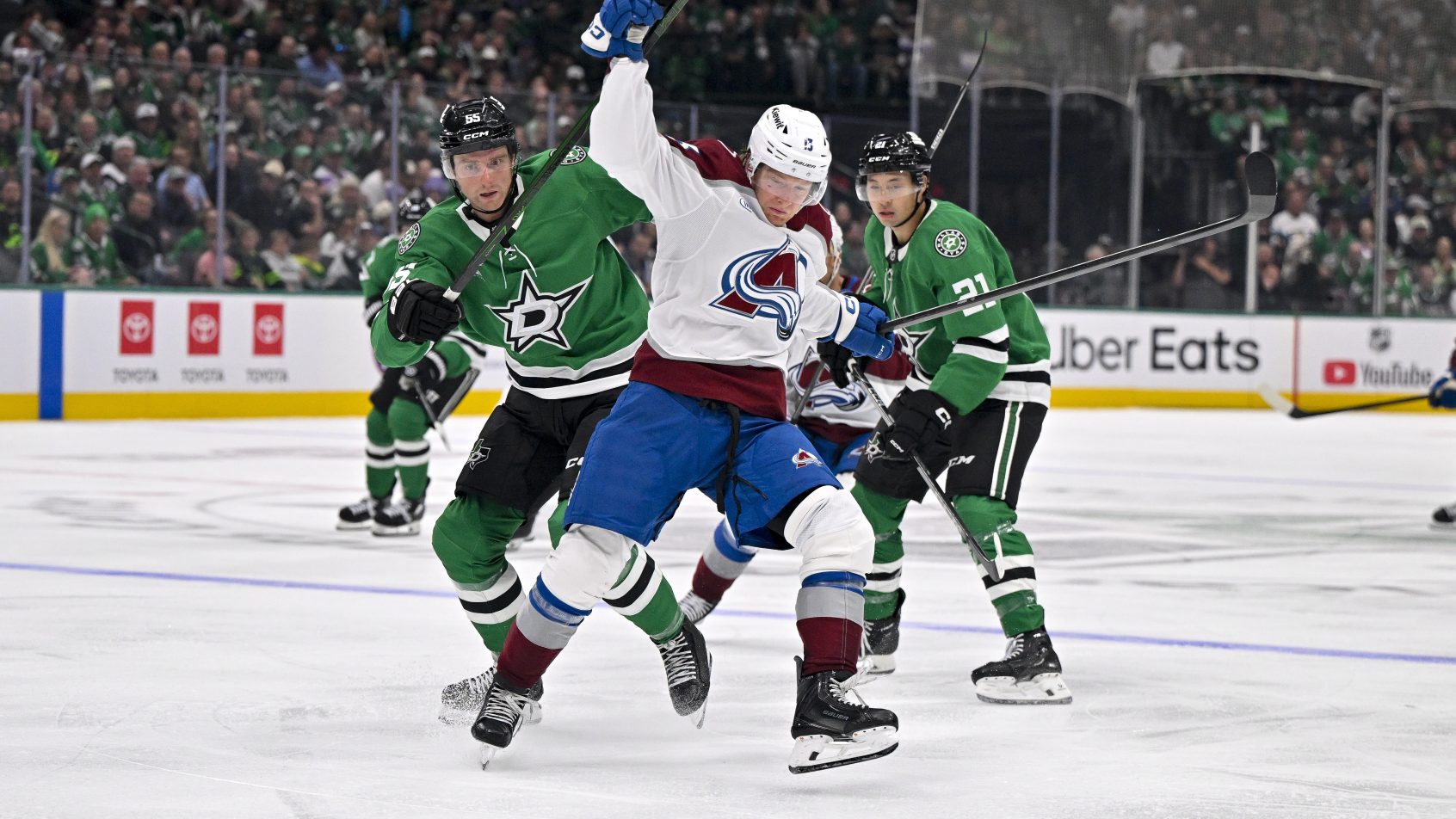 Colorado Avalanche forward T.J. Hughes plays the puck against the Dallas Stars