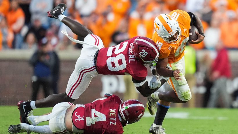 Tennessee running back DeSean Bishop breaks tackles against Alabama