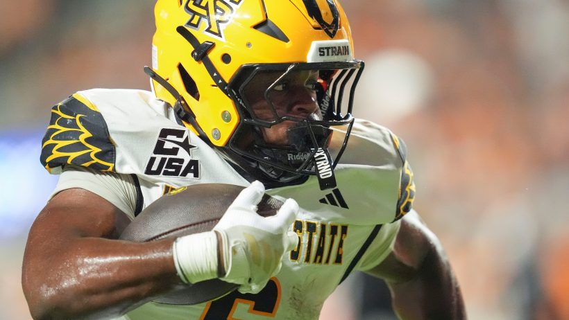Kennesaw State running back Latrelle Murrell carries the football against Tennessee