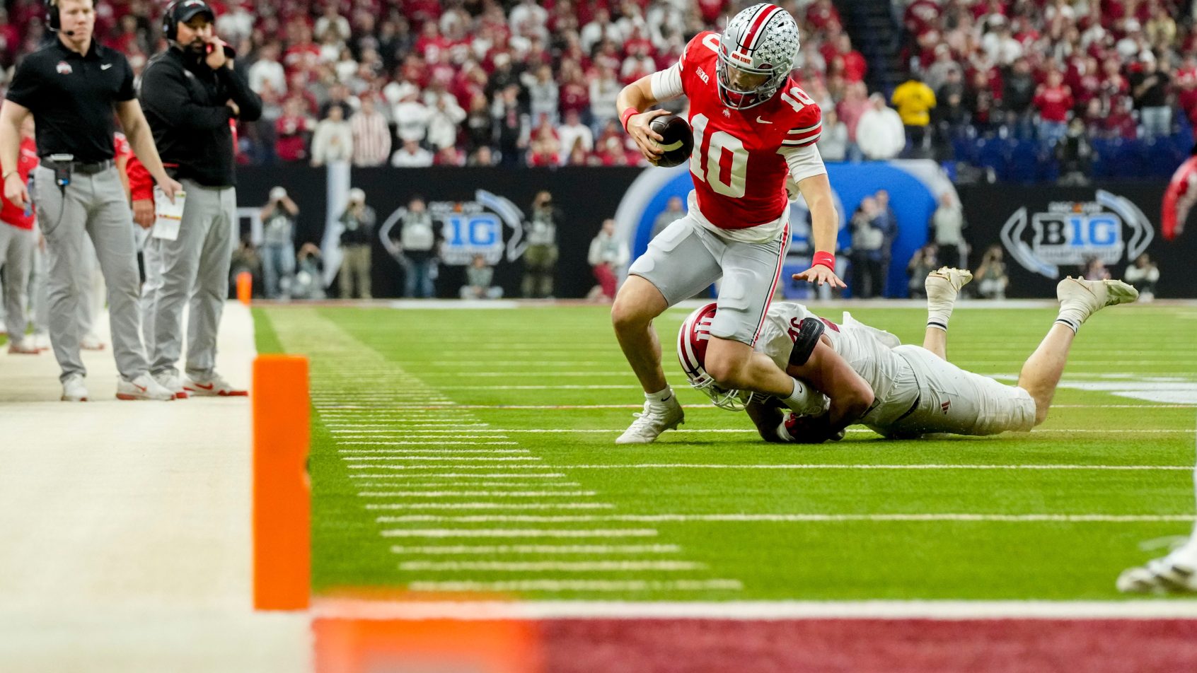 Indiana linebacker Isaiah Jones tackles Ohio State quarterback Julian Sayin