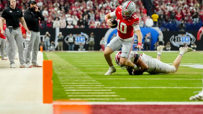 Indiana linebacker Isaiah Jones tackles Ohio State quarterback Julian Sayin
