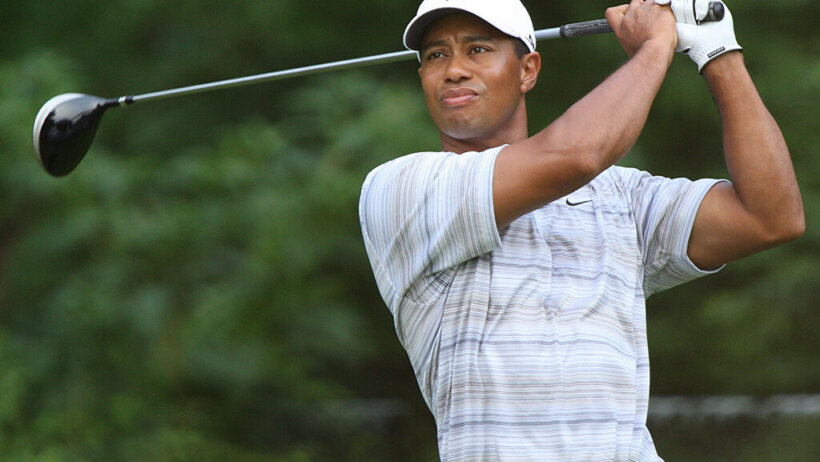 Tiger Woods admires his shot.