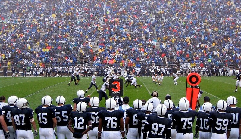 Penn State football players on the sideline