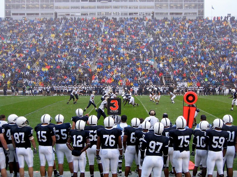 Penn State football players on the sideline