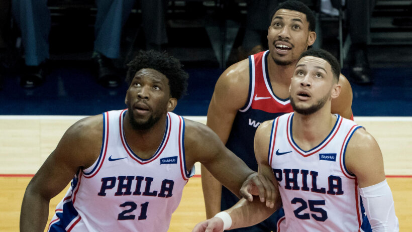 Joel Embiid and Ben Simmons box out Otto Porter Jr.