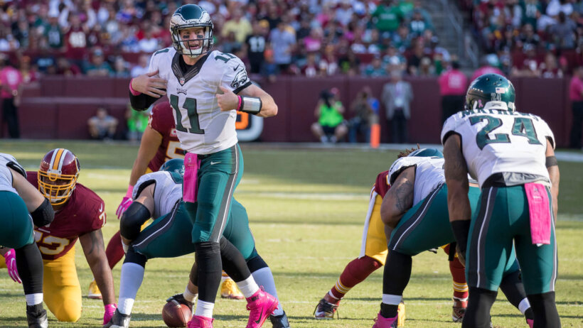 Carson Wentz communicating with his running back.