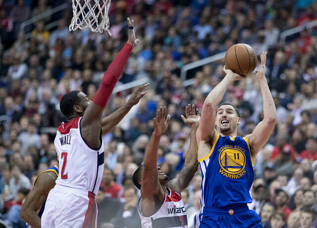 Klay Thompson shoots over John Wall