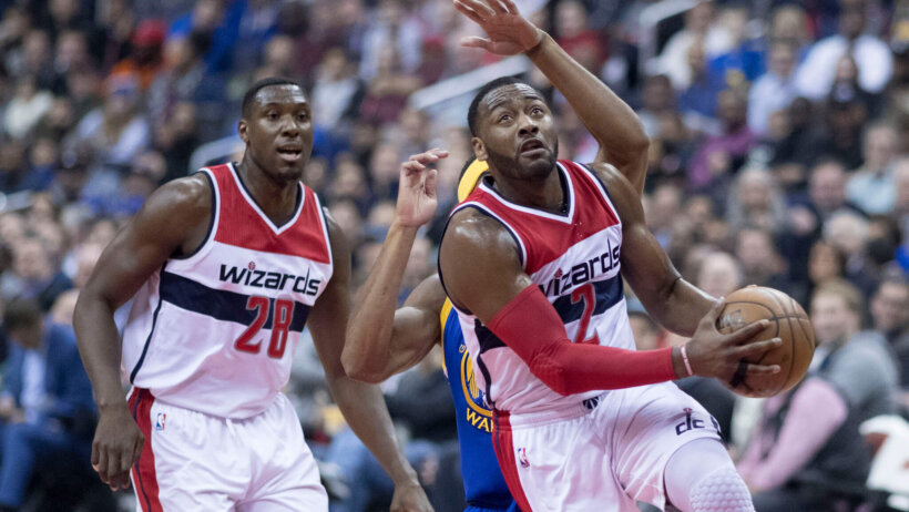 John Wall drives to the hoop against the Golden State Warriors.