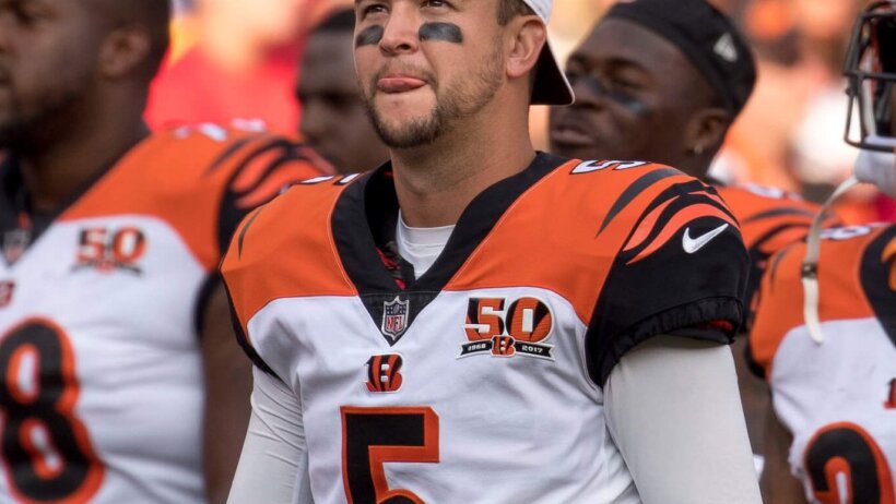 AJ McCarron walking off the field