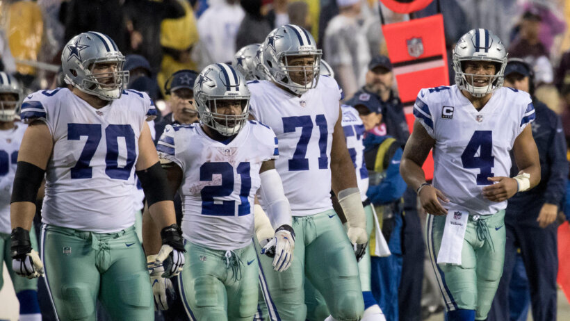 Ezekiel Elliott Dak Prescott Dallas Cowboys taking the field