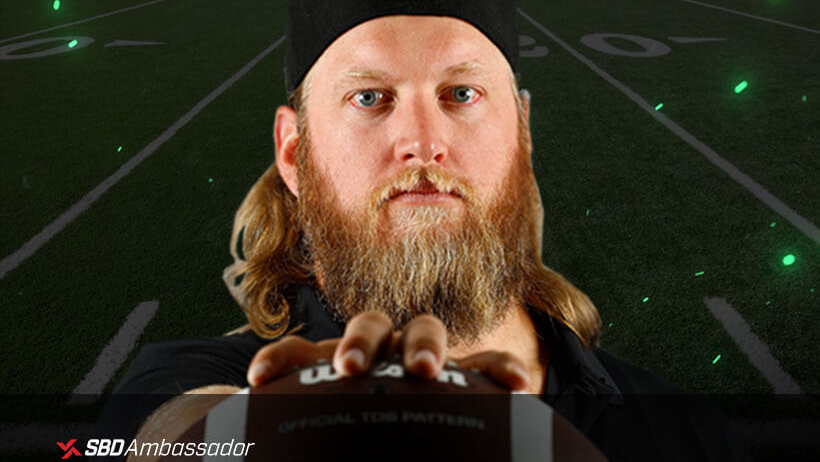 Nick Mangold holding a football