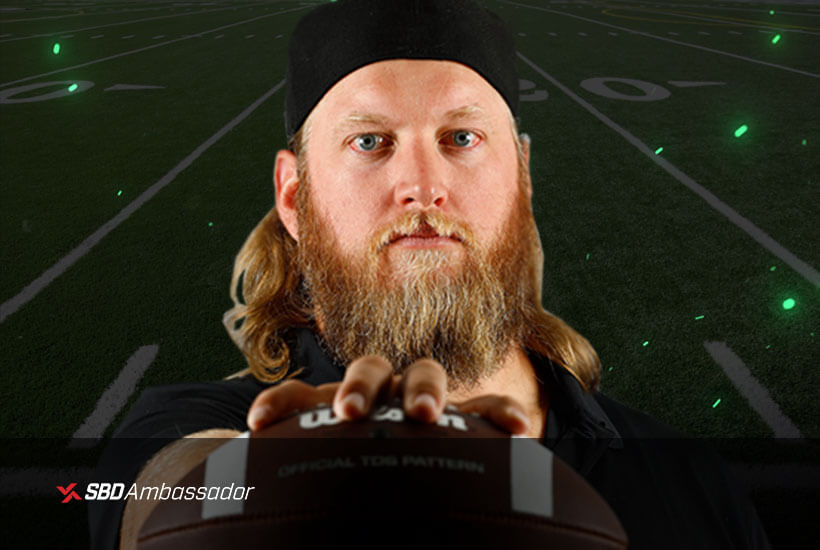 Nick Mangold holding a football