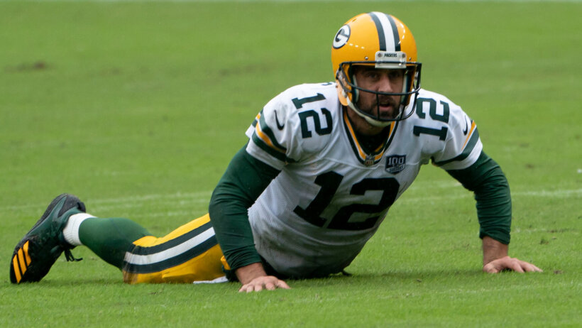Aaron Rodgers on the field with the Green Bay Packers