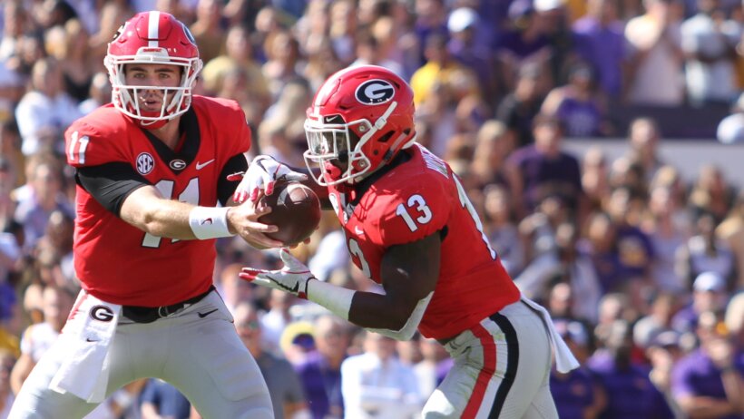Jake Fromm handing ball off