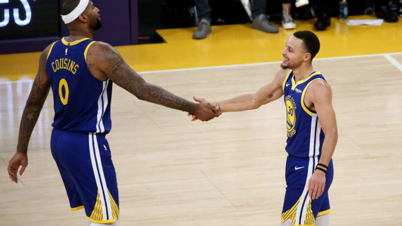 DeMarcus Cosuins and Steph Curry